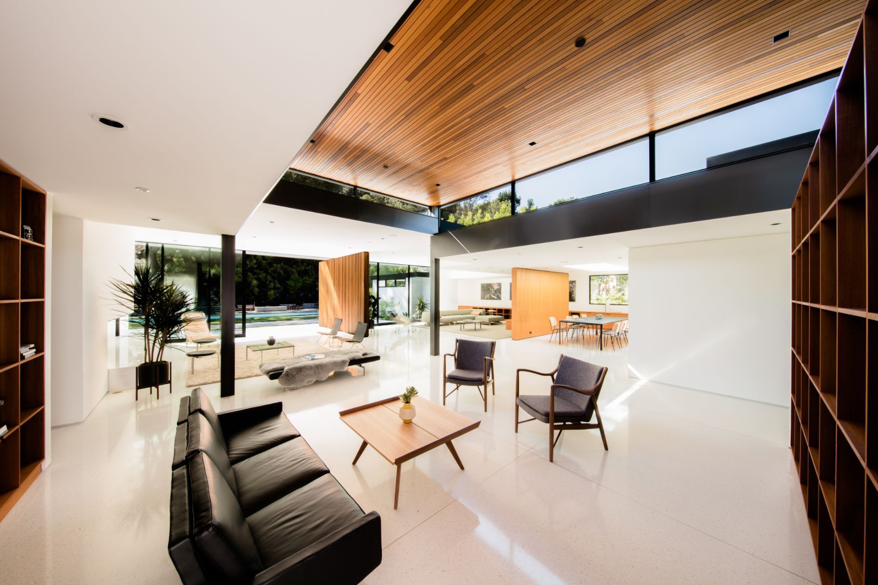 Living room under teak ceiling and clerestory windows